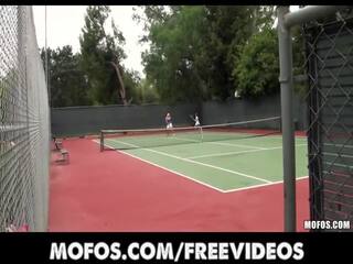 Enticing tennis MILFS are caught stretching before a match