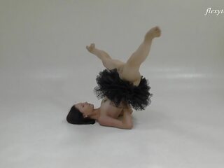 Russian brunette acrobat stretching her voluptuous long legs