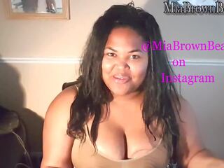 Mia pumps and strokes milk out of her big brown tits