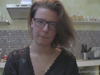 Solo darling with glasses chatting in the kitchen