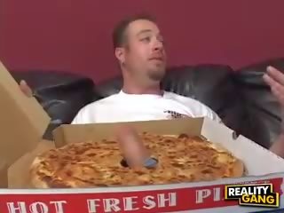 Milf with big tits gives a blowjob to a pizza delivery adolescent