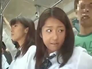 Two schoolgirls elläp tanamak in a awtobus